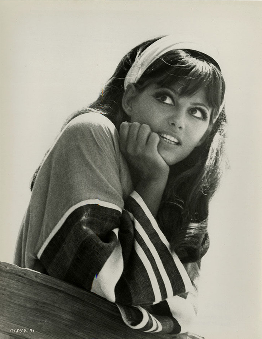 Claudia-Cardinale-watches-surfers-between-scenes-Dont-Make-Waves-1967.jpg