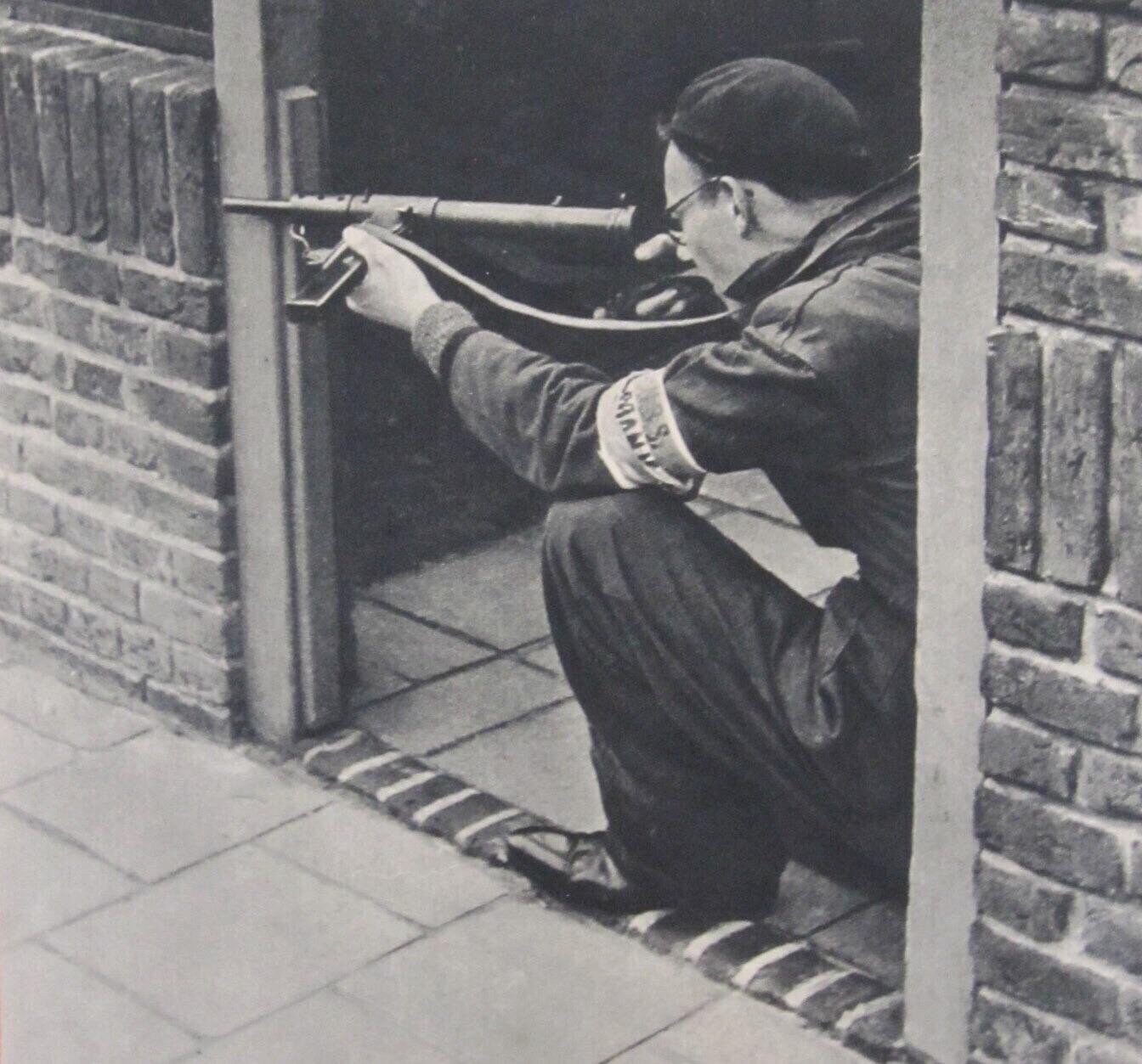 My grandfather, fighting for the Dutch resistance in Delft during WWII. He says he looks all cool but was actually shitting himself. ... and look at those shinie shoes!.jpg