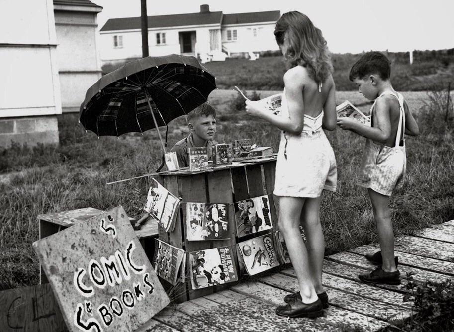 A young entrepreneur selling comics. Oak Ridge, Tennessee, 1940s.jpg