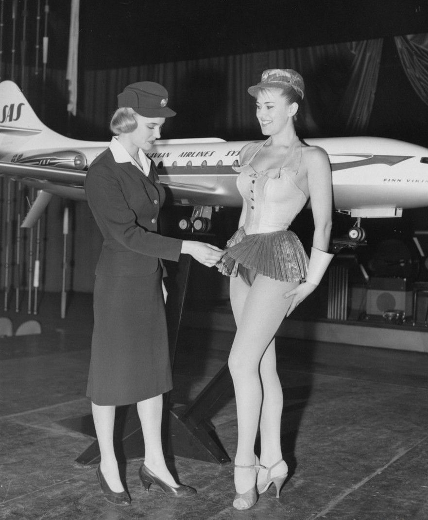 A Scandinavian Stewardess examines a new uniform proposal for Scandinavian Airlines in 1964. It was not approved.JPG