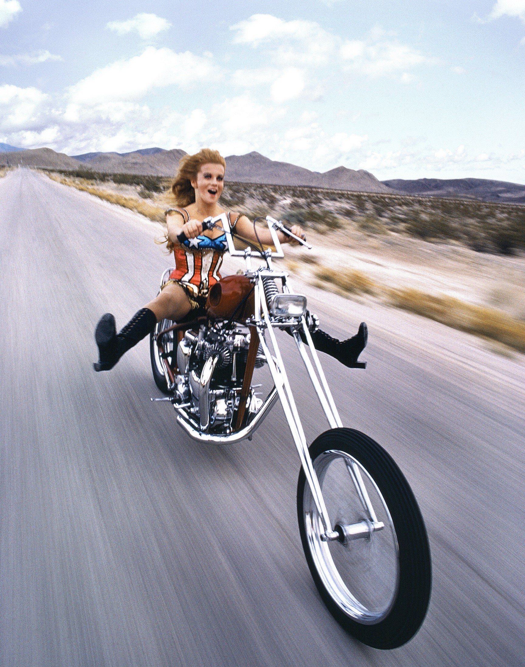 Academy Award nominee Ann-Margret tearing through the desert wearing an American Flag ensemble, 1971.jpg