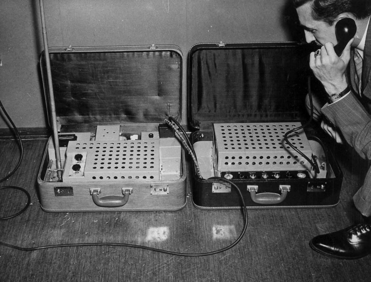 FBI agent tests a model of a portable two-way radio developed in 1947.jpg