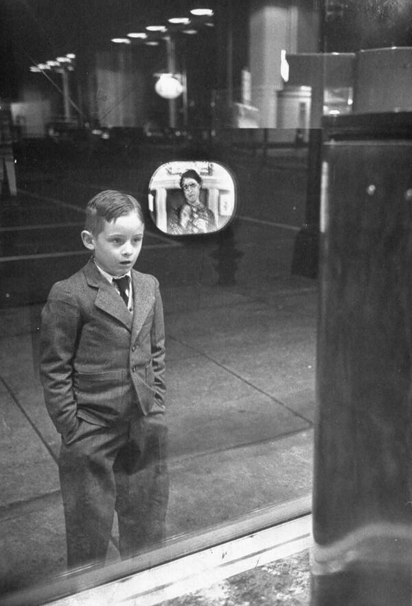 Watching the TV through a window - 1940.jpg