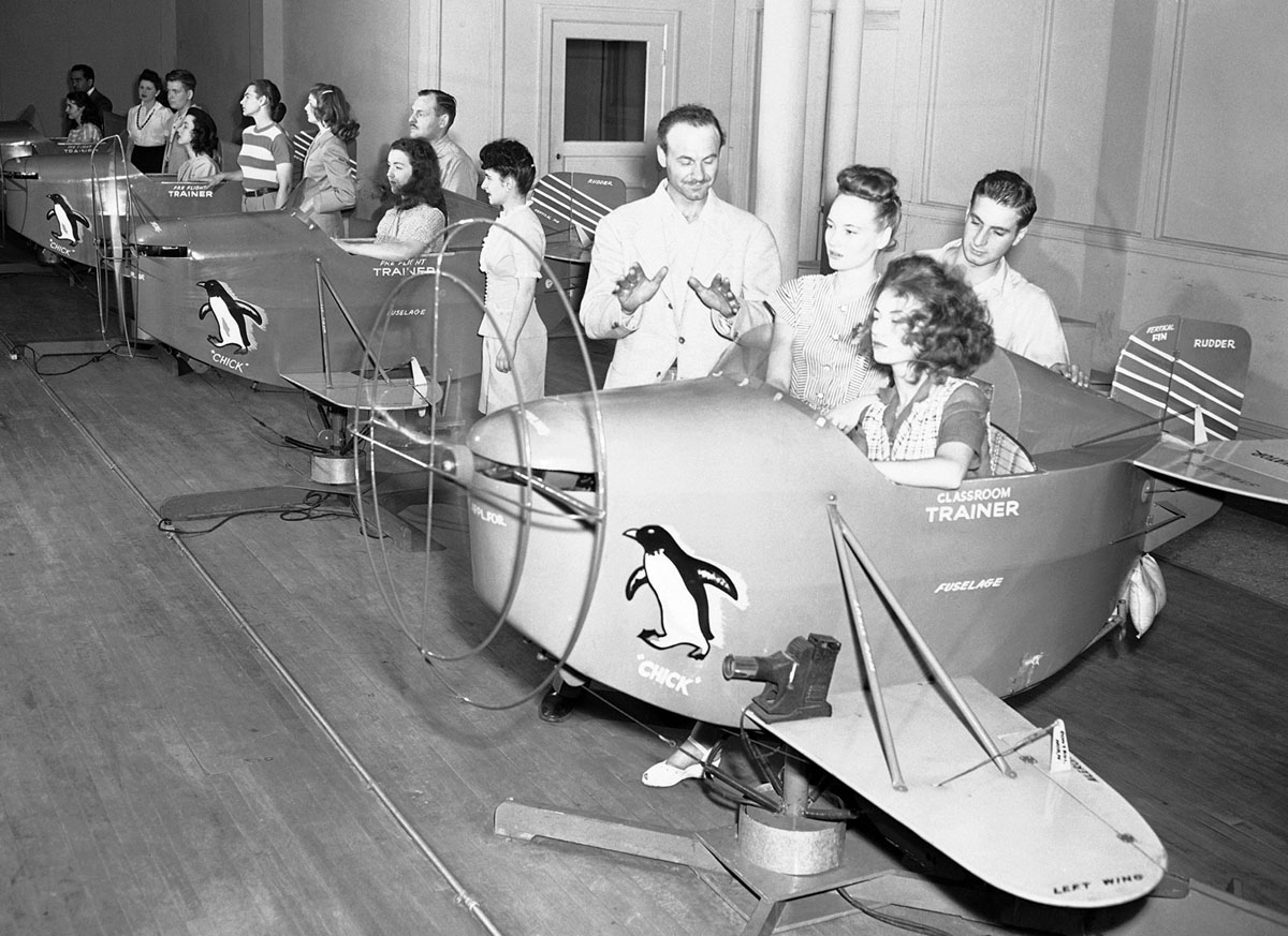 Instructor advises a student on the use of a preflight trainer (1945).jpg
