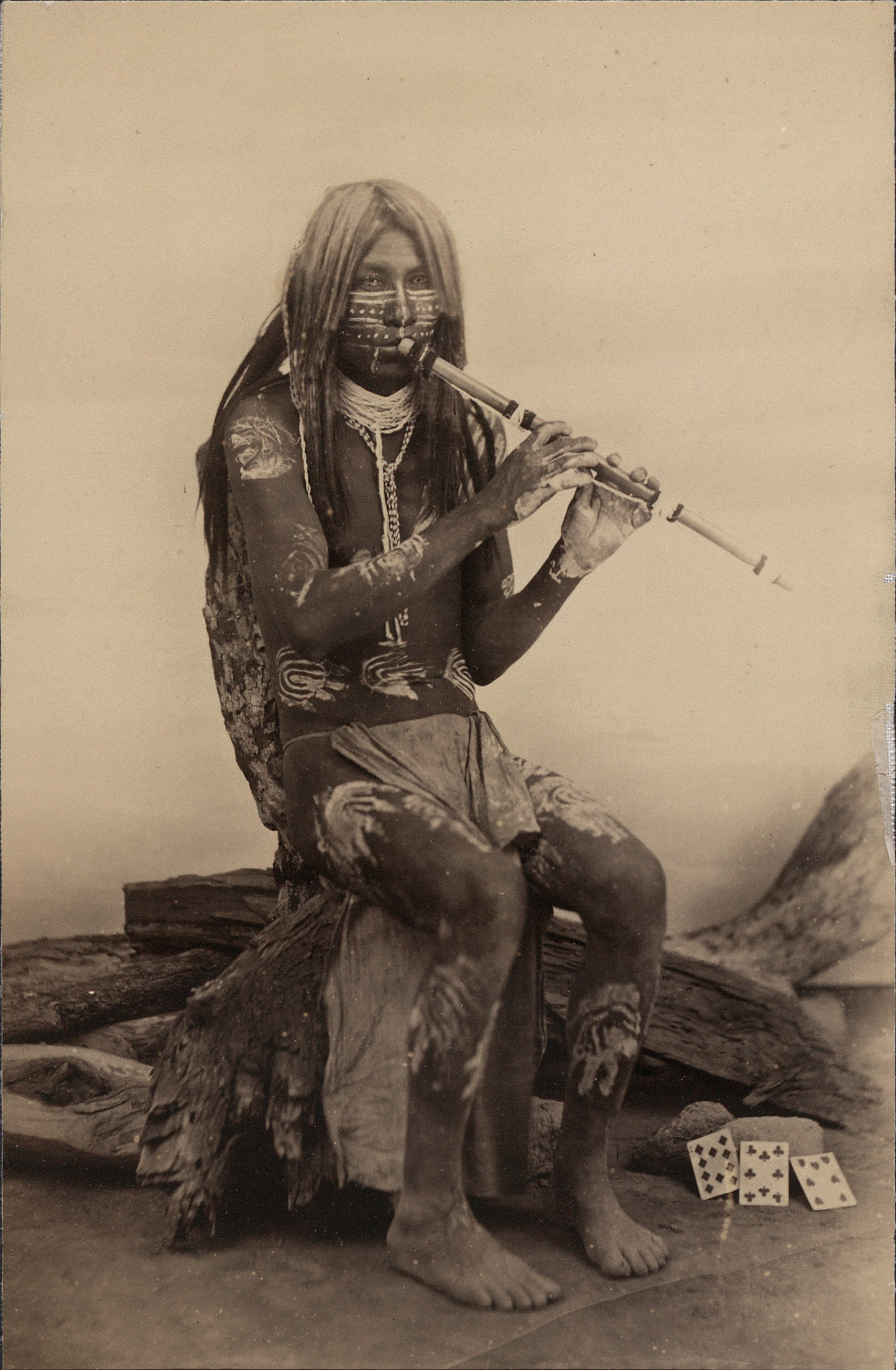 Yuma musician, in body paint playing a flute, Arizona, circa 1870.jpg