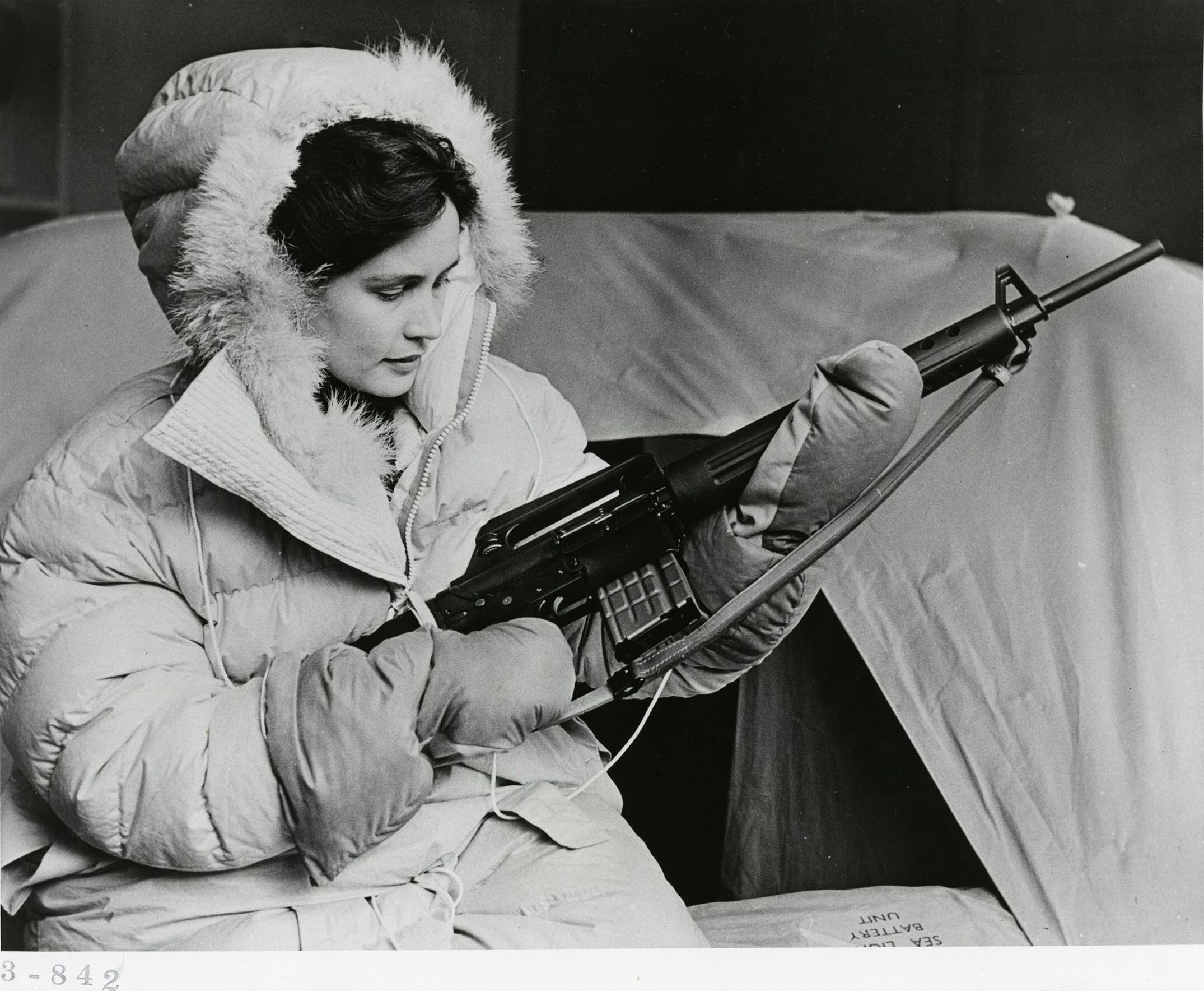Dutch flight attendant displays polar survival gear issued to commercial aircrews that flew over the north pole, 1959.jpg