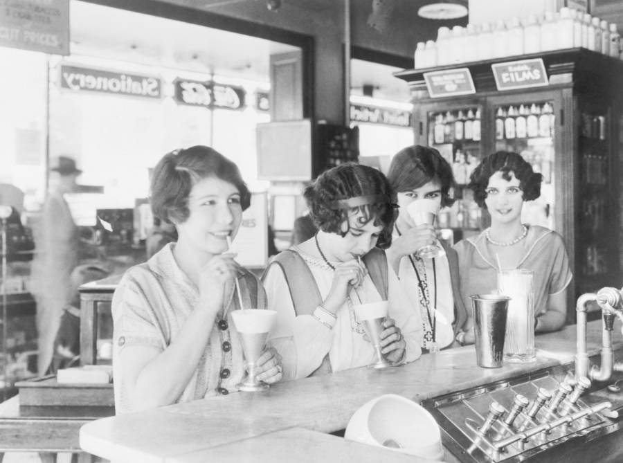 Flappers at a soda fountain drinking milk shakes in 1926.jpg