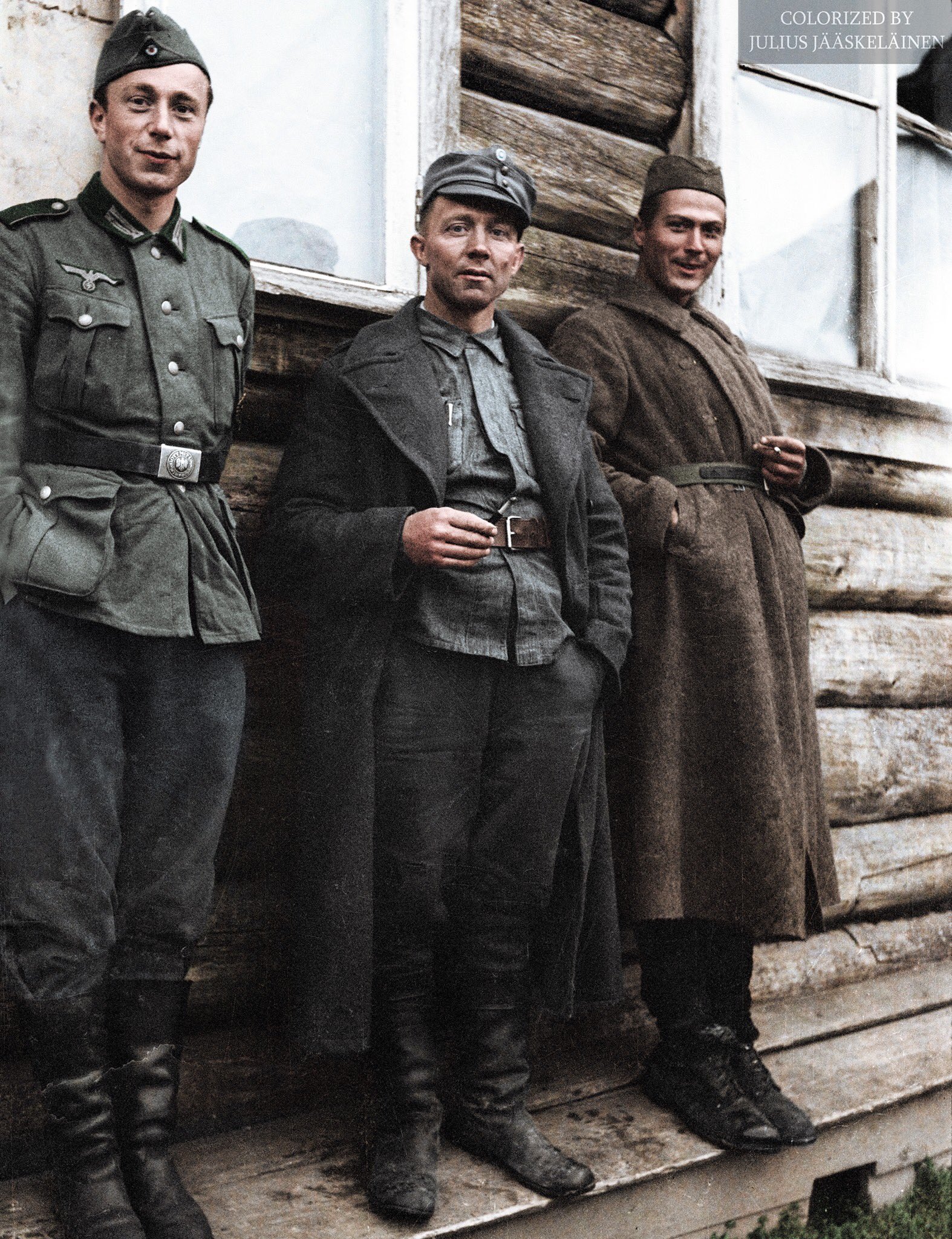 A German, a Finn and a Russian having a smoke outside a POW hospital (1941).jpg
