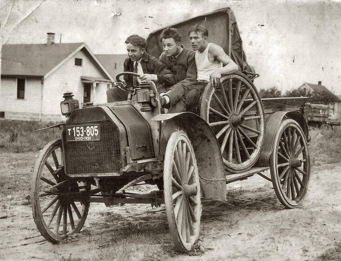 Three young men in a vehicle, circa 1924.jpg