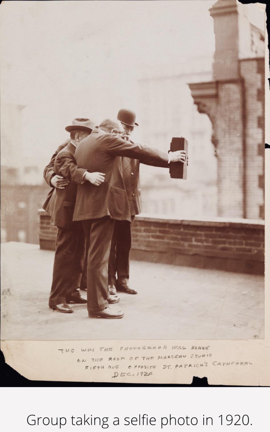 Group taking a selfie photo; circa 1920.jpg