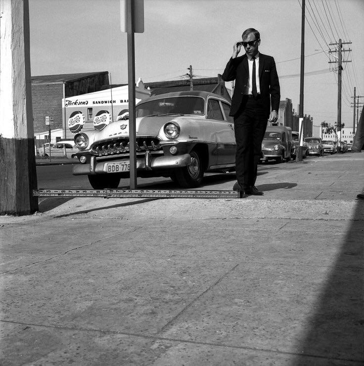 City Engineer at work measuring the level of the footpath on Botany Road, Sydney, Australia 1965.jpg