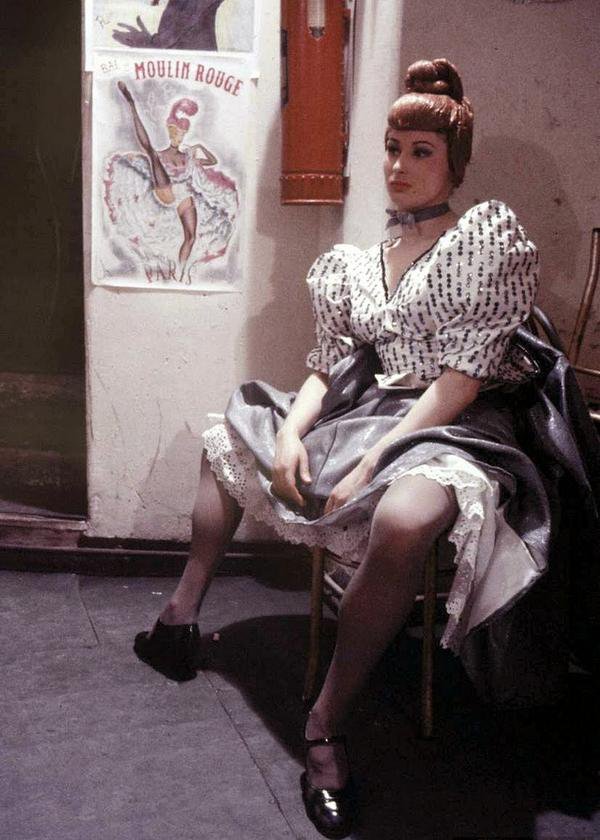A Moulin Rouge dancer having a rest. Paris 1953.jpg