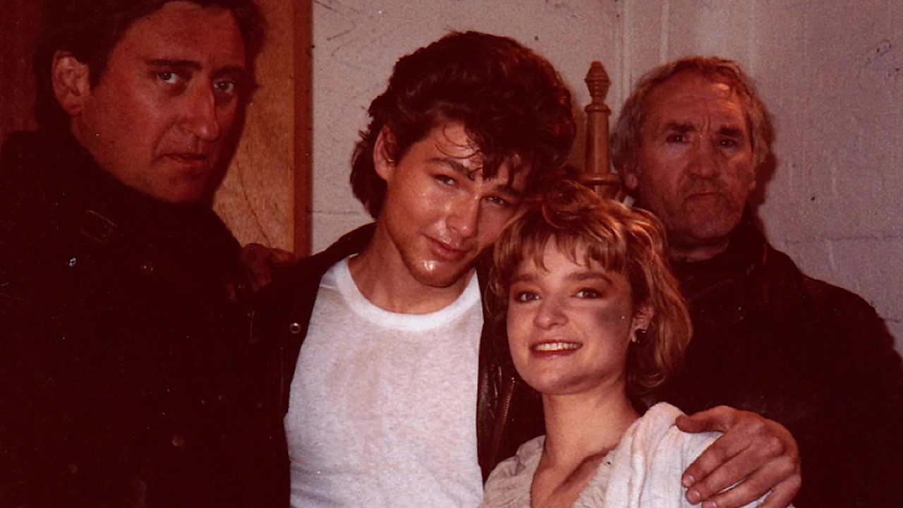 A-ha's lead singer Morten Harket and actress Bunty Bailey together with the two evil motorcyclists during the shooting of the music video Take On Me. 1985.jpg