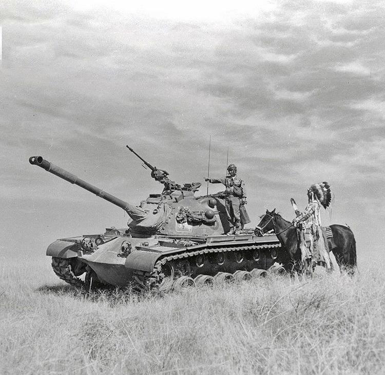 Chief Thomas K. Yallup of the Yakima Indian Tribal Council, visits his son, Cpl. Bill Yallup, who was training as a tanker at the Yakima Firing Center, 1954.jpg