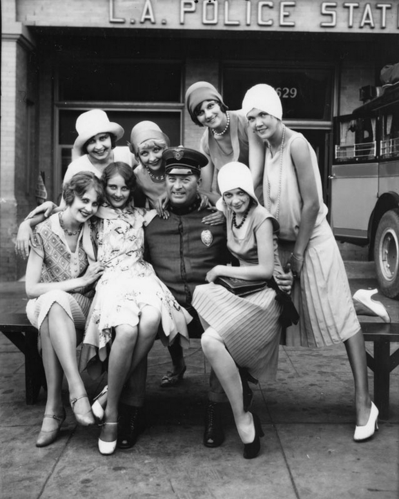 Models and L.A. policeman in an ad for the Pickwick Motor Stages Bus Company, 1928.jpg