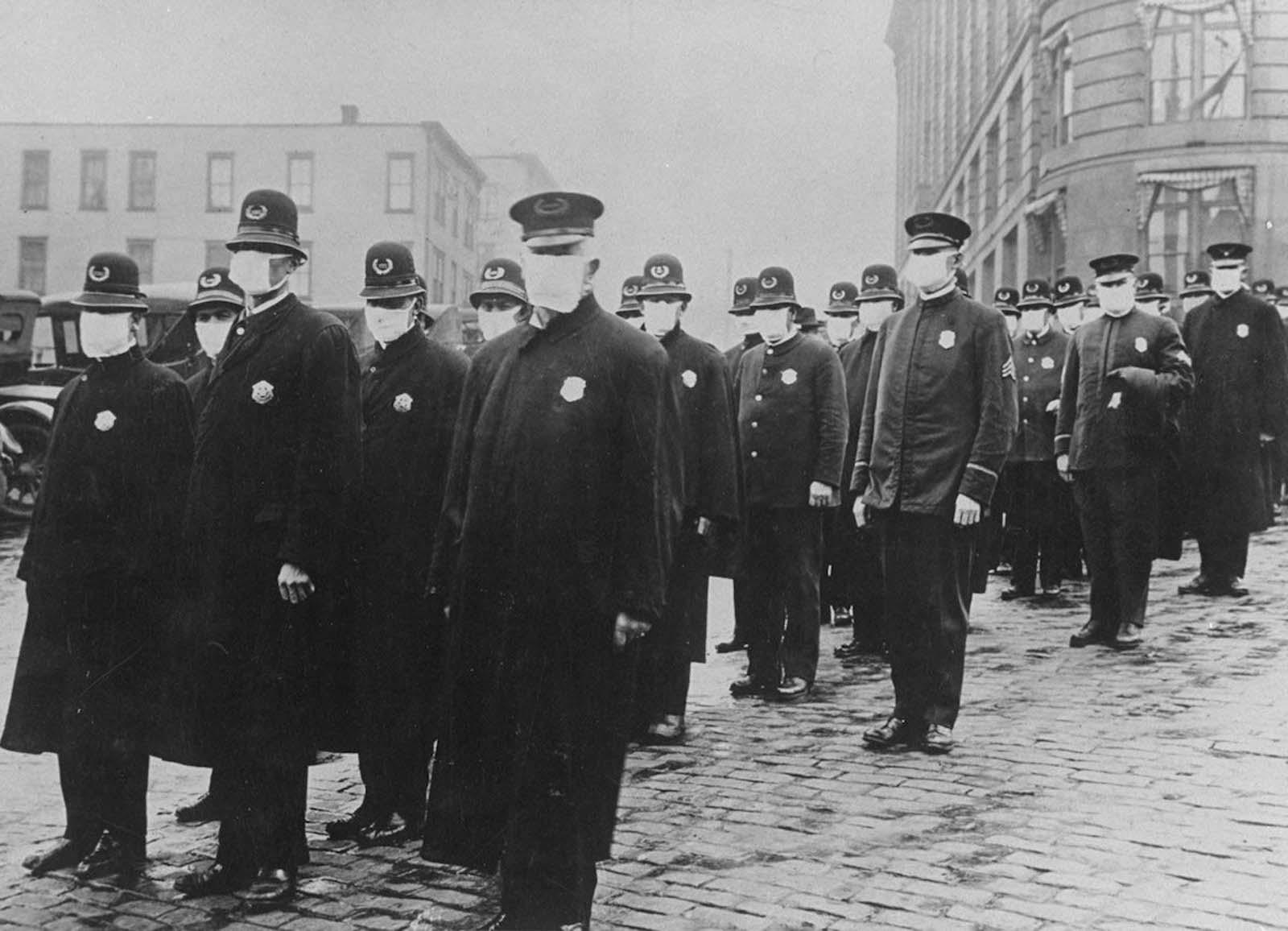 Seattle policemen wear protective gauze face masks during the influenza epidemic, 1918.jpg