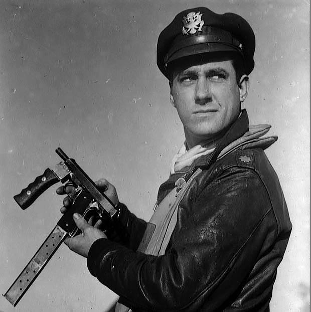 Ace pilot Major David C. Schilling with his custom automatic M1911A1 handgun, 1944.png