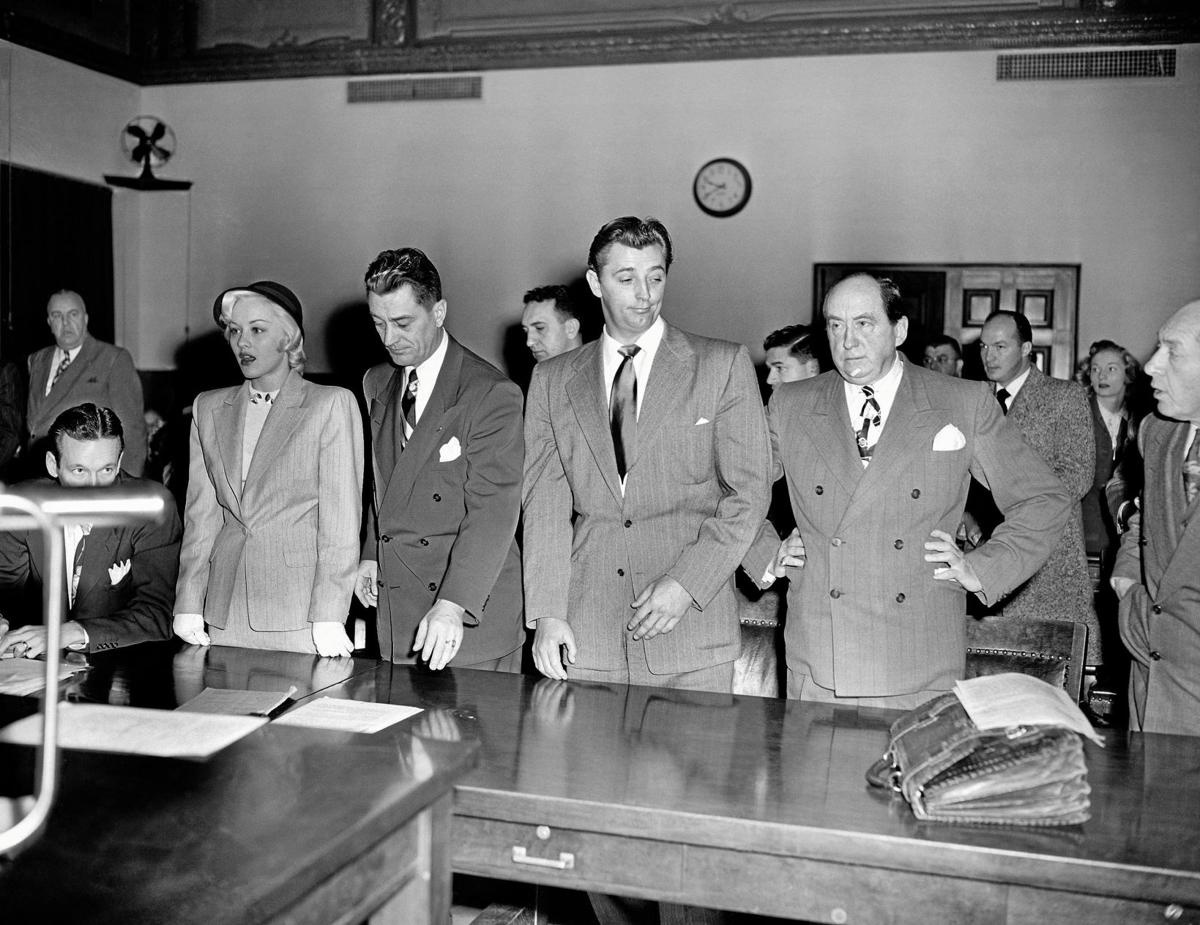 Actor Robert Mitchum and actress Lila Leeds, are sentenced to 60 days in jail on charges of conspiracy to possess marijuana cigarettes in 1949.jpg