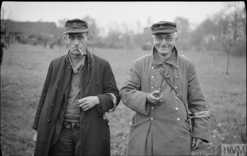 Two old members of the Volksturm captured by British troops in Bocholt, in the Rhineland region of Germany, 28 March 1945.jpg