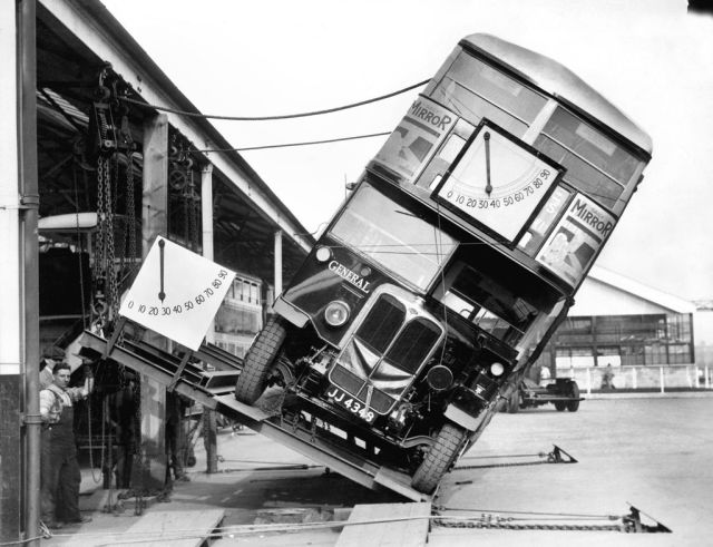 Workmen testing a London’s Double-decker bus on a tilt table 1933.jpg
