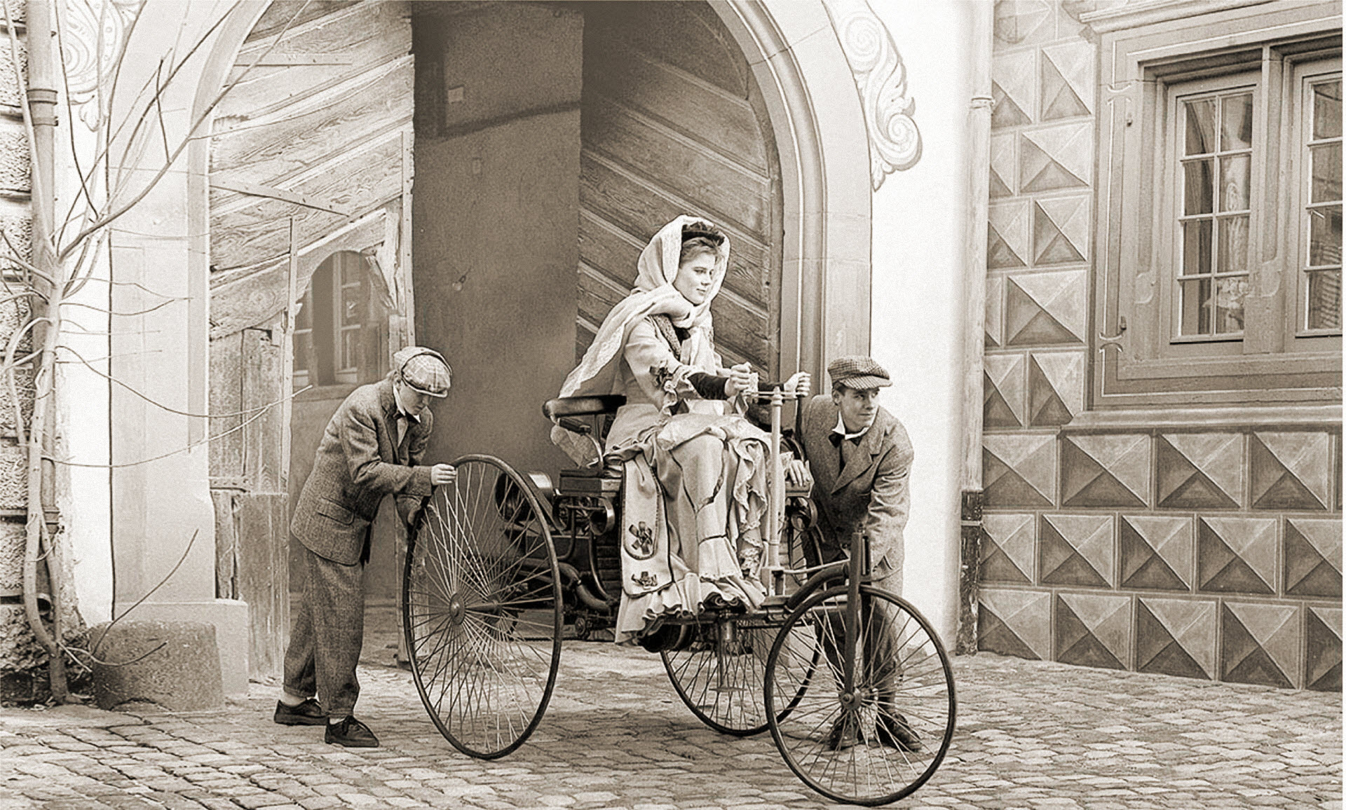 Bertha Benz, driving the Benz Patent Motorwagen, widely regarded as the world's first production automobile, circa 1886.jpg