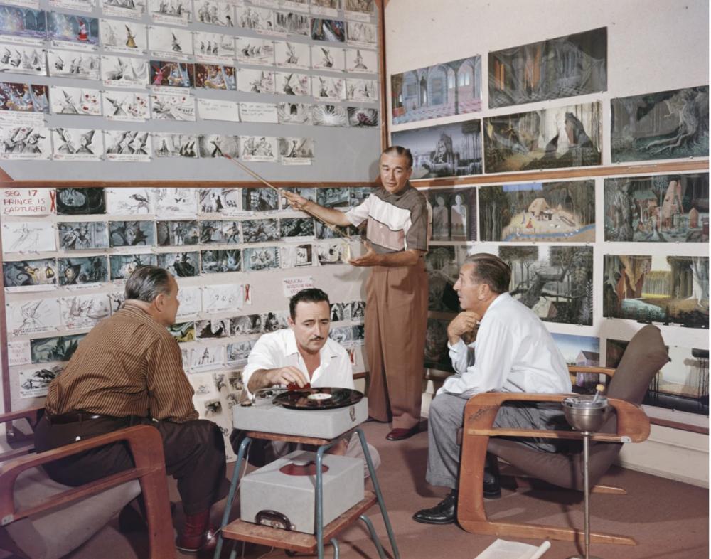 Walt Disney listening to an animator walk him through Sleeping Beauty storyboards, 1959.jpg