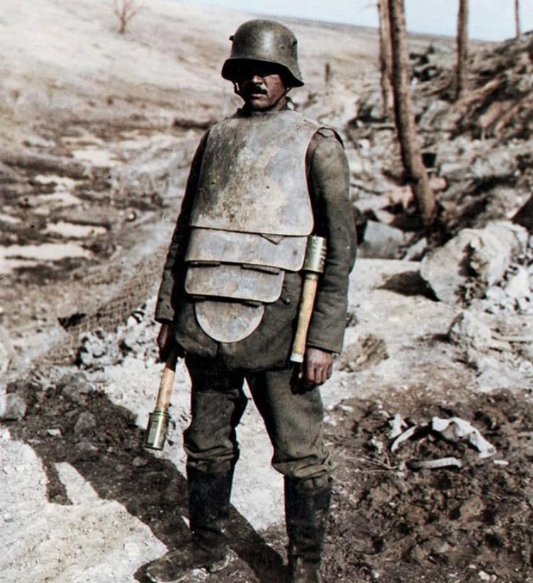 German soldier in body armour, holding a stielhandgranate in 1918.jpg