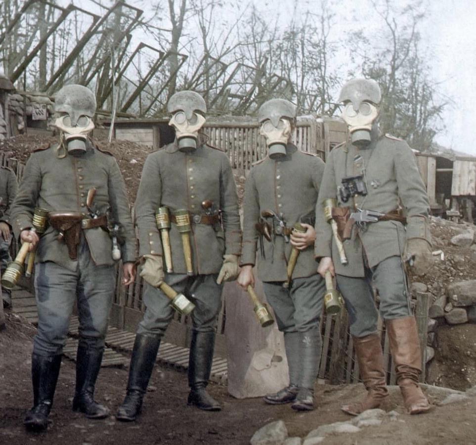 Four German infantrymen wearing gas masks and Gaede model 1915 helmets.jpg