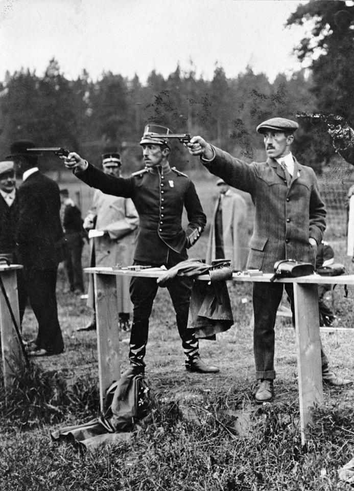 Olympics in Stockholm 1912. Lieutenants Eric and Wilhelm Carlberg (twins) shooting pistol. They won serveral gold, silver and bronze medals.jpg