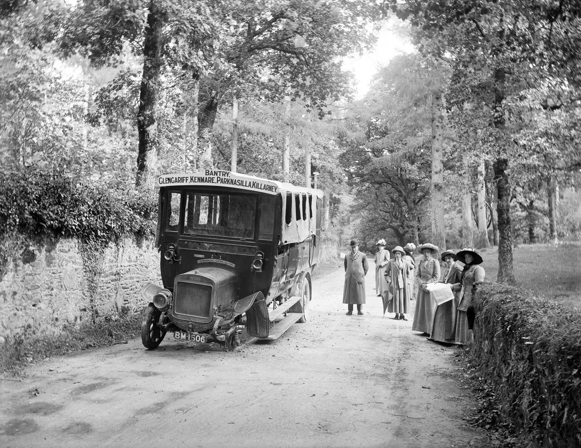 Ladies and gentleman next to their broken down charabanc, near Killarney. County Kerry, Ireland, 1910.jpg