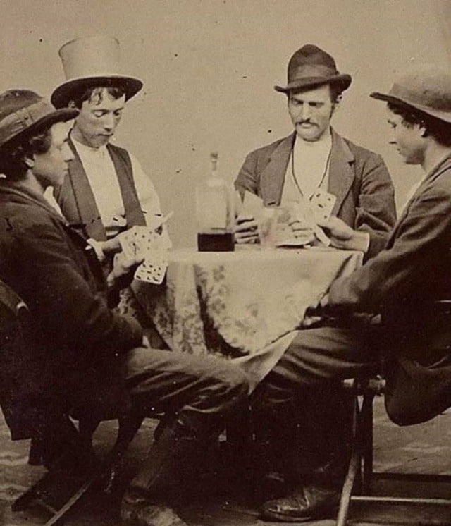 Billy the Kid (the 2nd person to the left) playing cards ,1877.jpg
