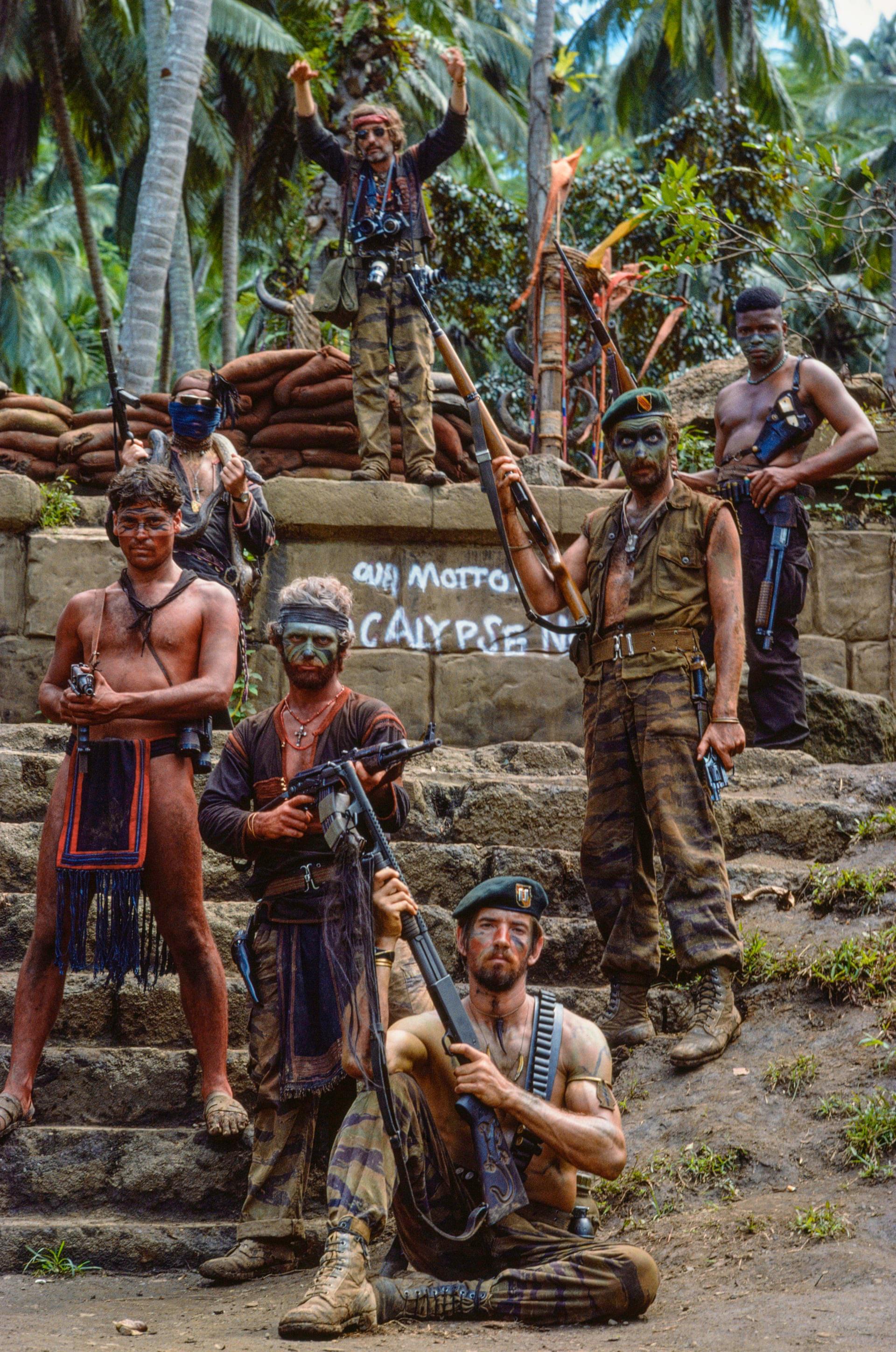 Dennis Hopper and other extras on the set of Apocalypse Now. (1976).jpg