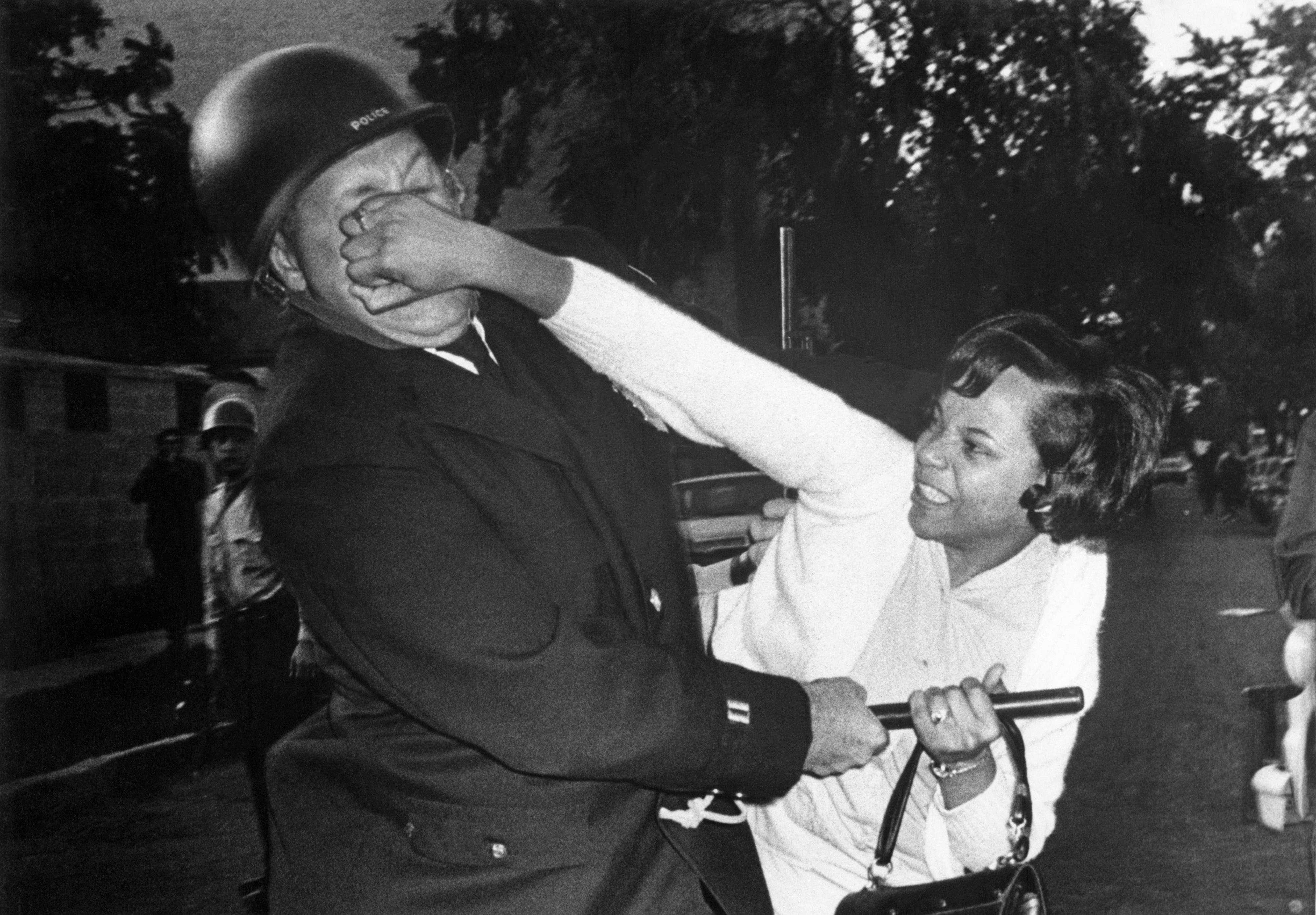 A woman struggle with police during the Summer 1967 unrest in Milwaukee.jpg