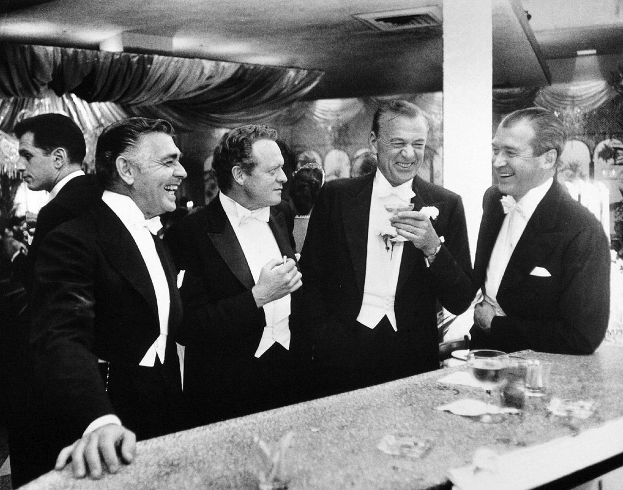 Clark Gable, Van Heflin, Gary Cooper and Jimmy Stewart. New Year’s Eve 1957 in the Crown Room at Romanoff’s restaurant in Hollywood.jpg