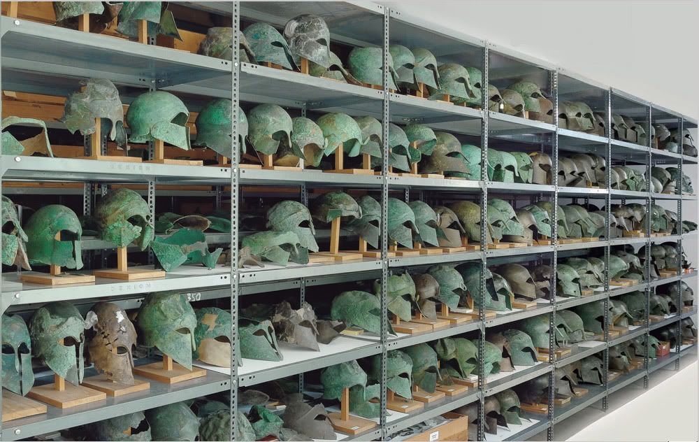Olympia Museum storeroom. Helmets from 510 BC to 323 BC.jpg
