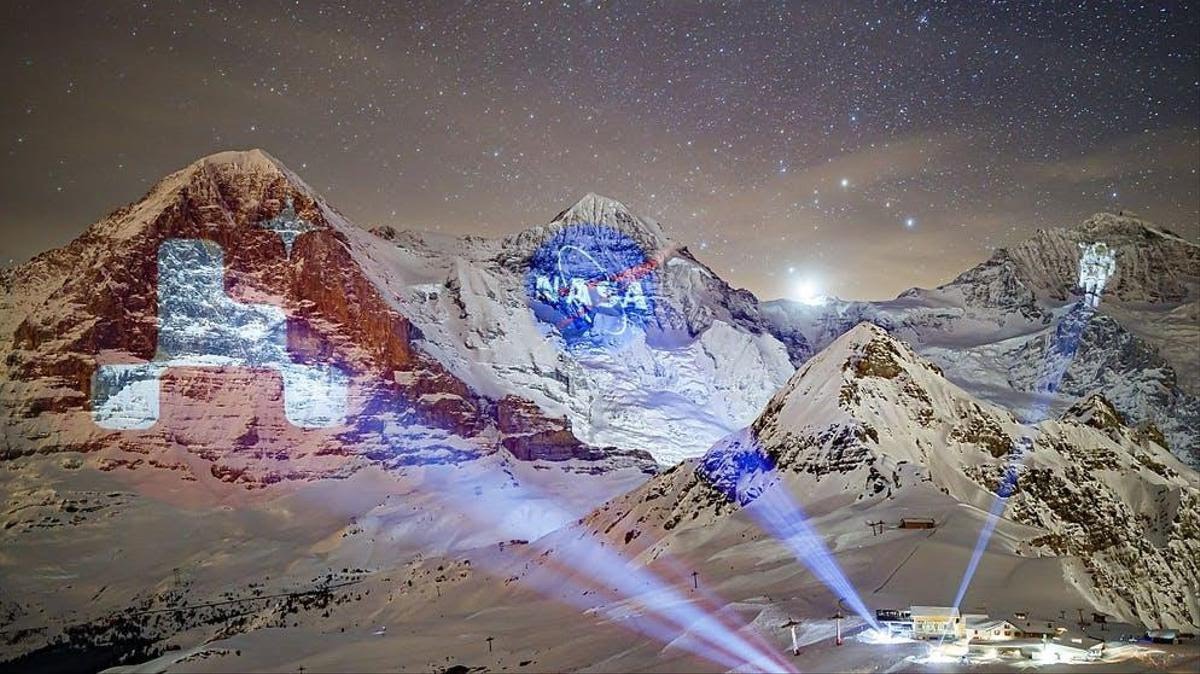 Switzerland celebrates the mars landing by projecting NASA images onto mountain range.jpg
