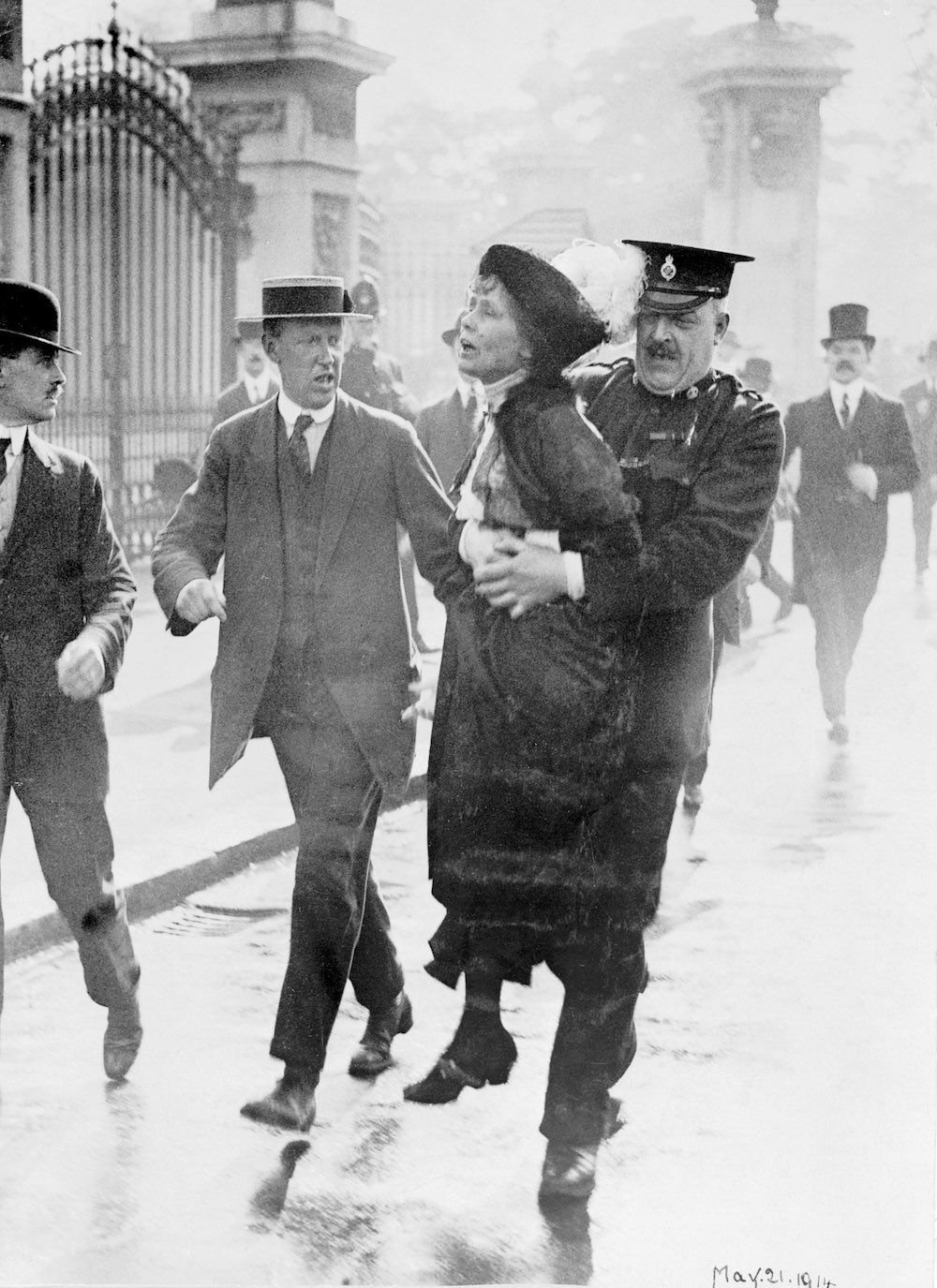 A suffragette being arrested and carried away from her protest, 1914.jpg