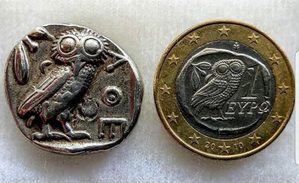 Ancient Greek coin dating back to 425-400BC is the inspiration the the Greek one-euro coin of today - The owl is the heraldic animal of Athens.jpg