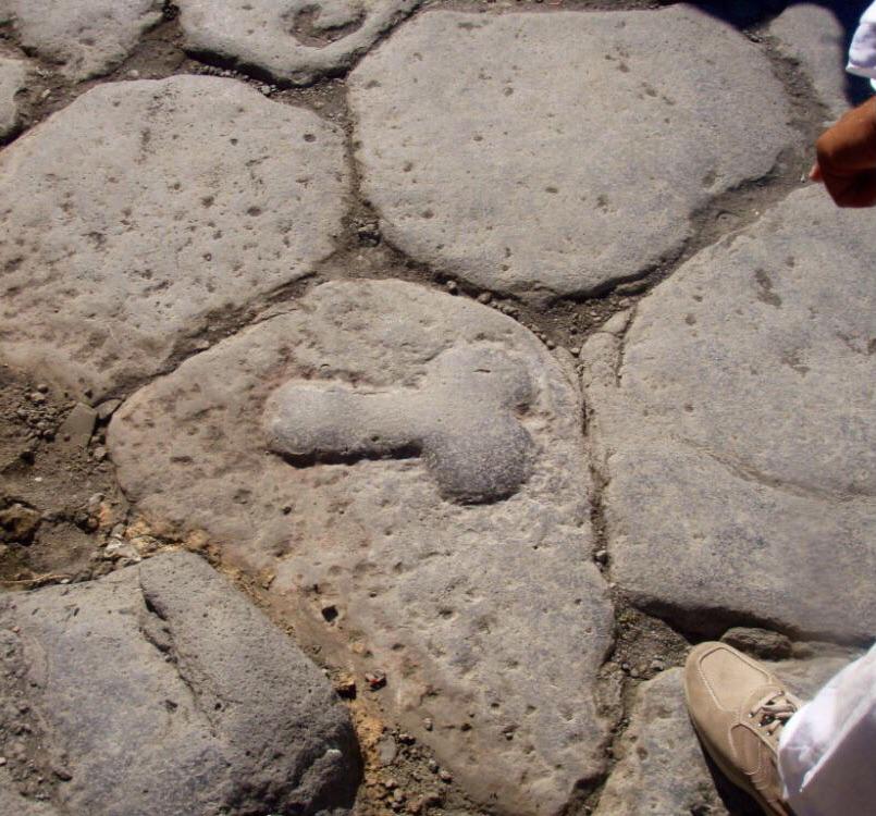 In Pompeii, phallic symbols on local roadways pointed the way to the nearest brothel; possibly to direct foreign sailors who didn't speak Latin.jpg
