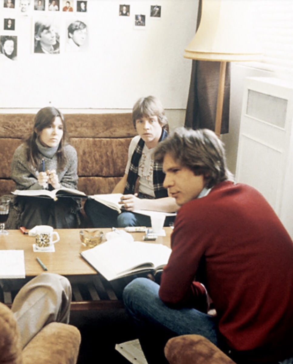 Carrie Fisher, Mark Hamill, and Harrison Ford going over the script for The Empire Strikes Back in 1979.jpg