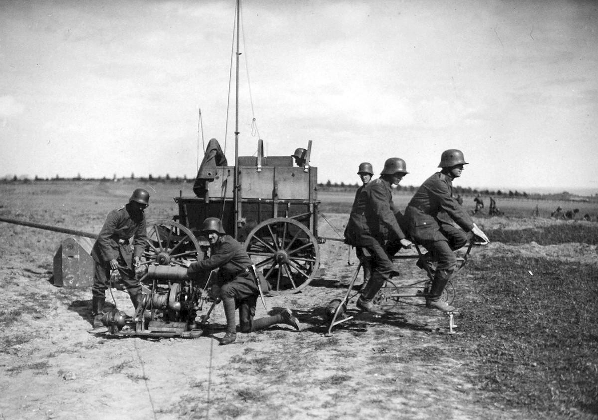 A German communications squad behind the Western front, setting up power generator to power a light radio station, September, 1917.jpg