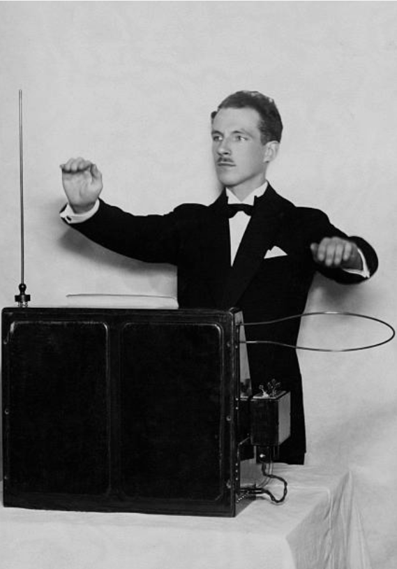 Professor Leo Theremin from the USSR, Leningrad, demonstrates his invention, Music from the Ether (later named after him - theremin), one of the first electronic musical instruments. circa 1927.png