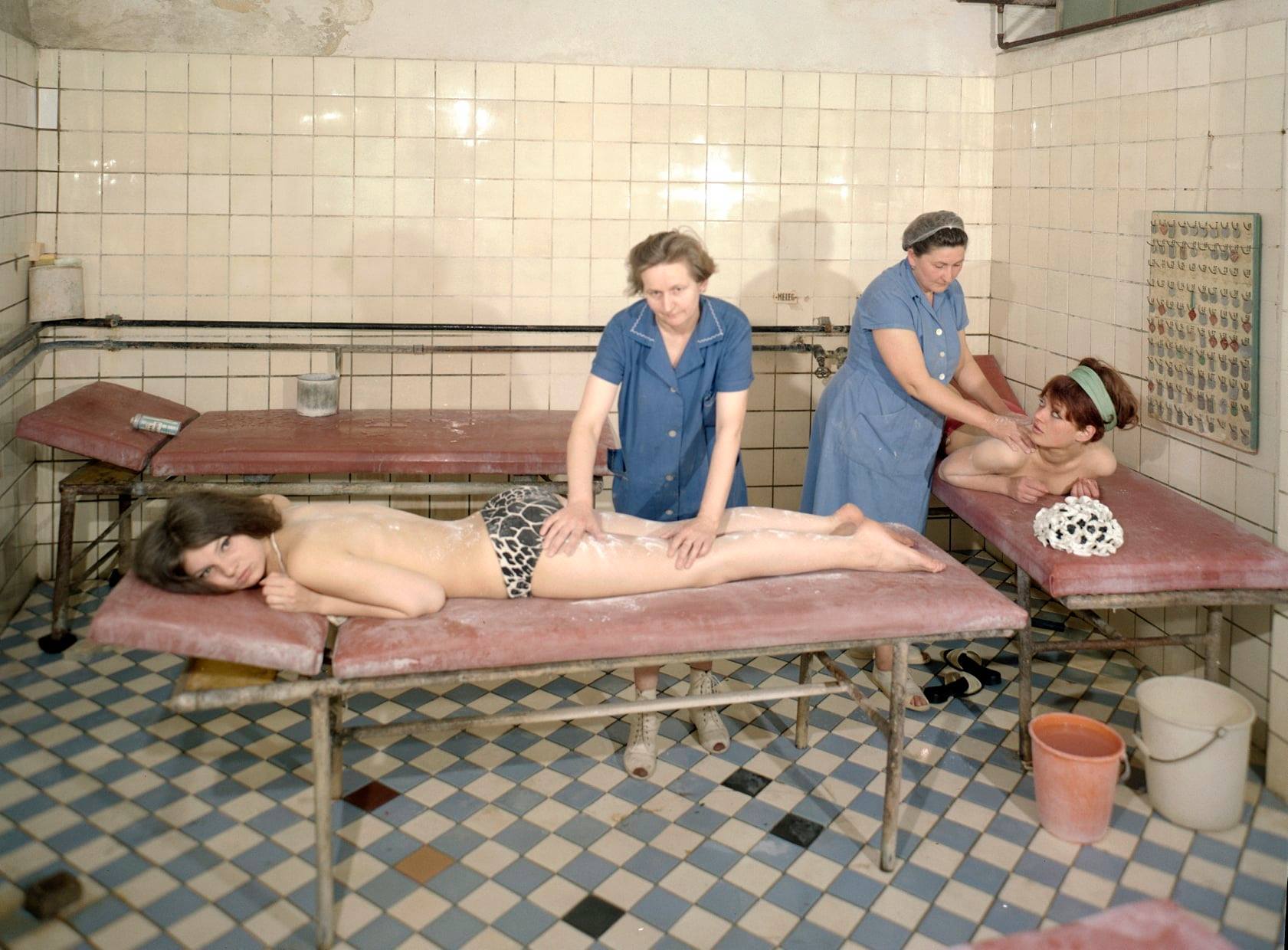 Young women enjoying a therapeutic powder massage at a thermal spa in Budapest. Hungary, 1968.jpg