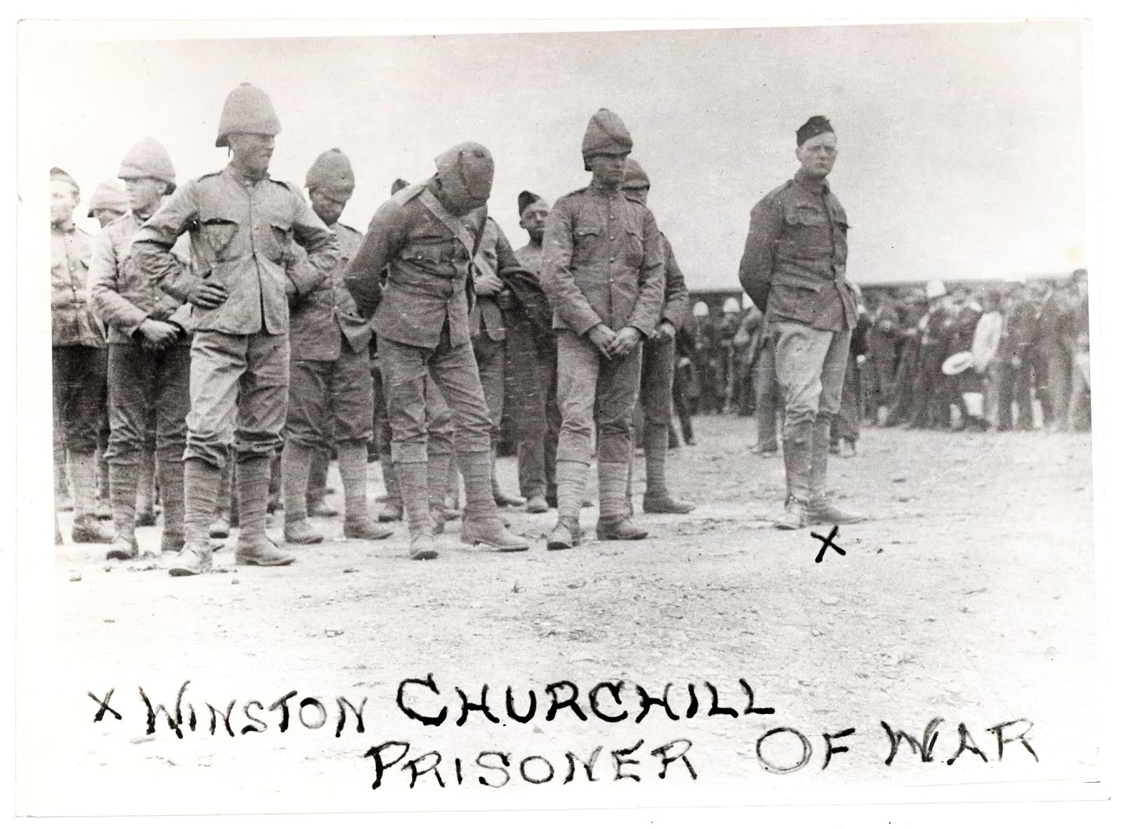 Winston Churchill in his 20s standing alongside fellow POWs ..After escaping alone and navigating through enemy territory he returned leading a team who freed the remaining prisoners, circa 1900.jpg