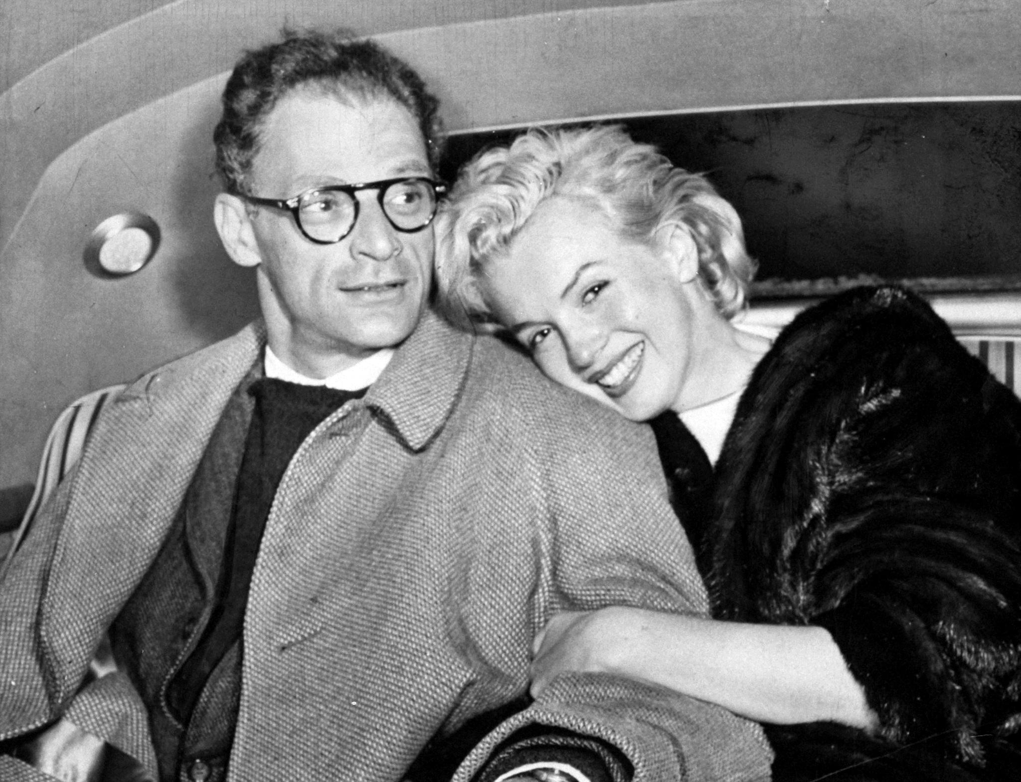 Marilyn Monroe and Arthur Miller in their car at Idlewild Airport returning from their honeymoon, 1956.jpg