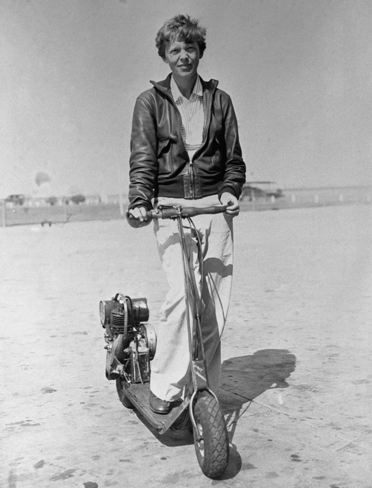 Amelia Earhart and a motorized scooter in the 1930's.jpg