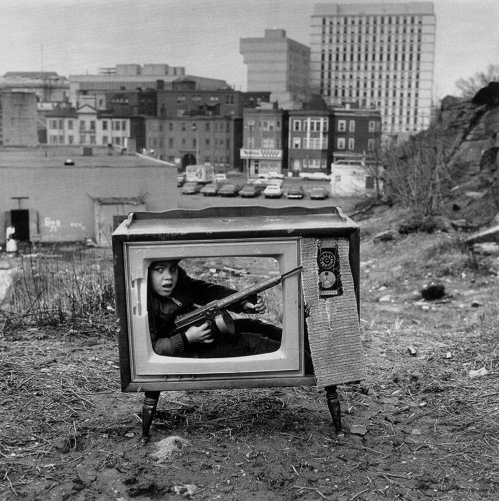 Boy hiding in a TV set; Boston, 1972.png