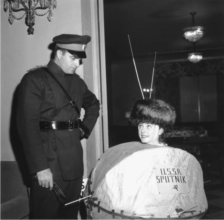 US couple dressed as Sputnik and a Soviet officer for Halloween party on October 31, 1957. Los Angeles, California.png