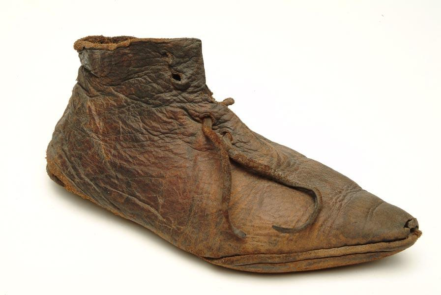 A Medieval Leather Shoe from 1300's England, on display at the Museum of London.png