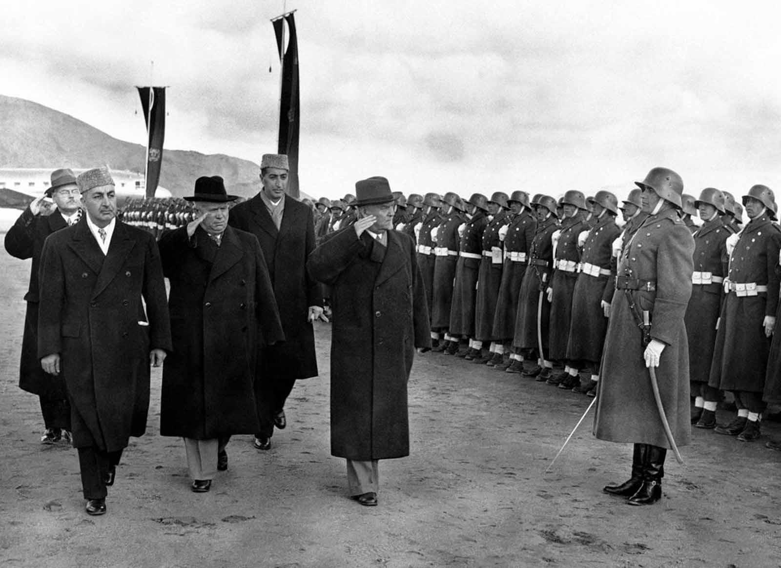 (1955) Nikita Khrushschev during a visit in Kabul, inspecting Afghan military - wearing WW2 Wehrmacht uniforms and Stahlhelms.jpg